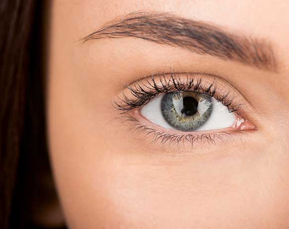 close-up shot of eyes of woman before and after retouch